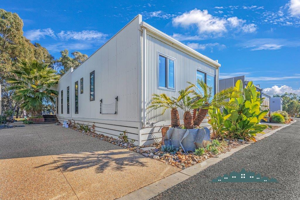 Rear with driveway for boat and vehicle